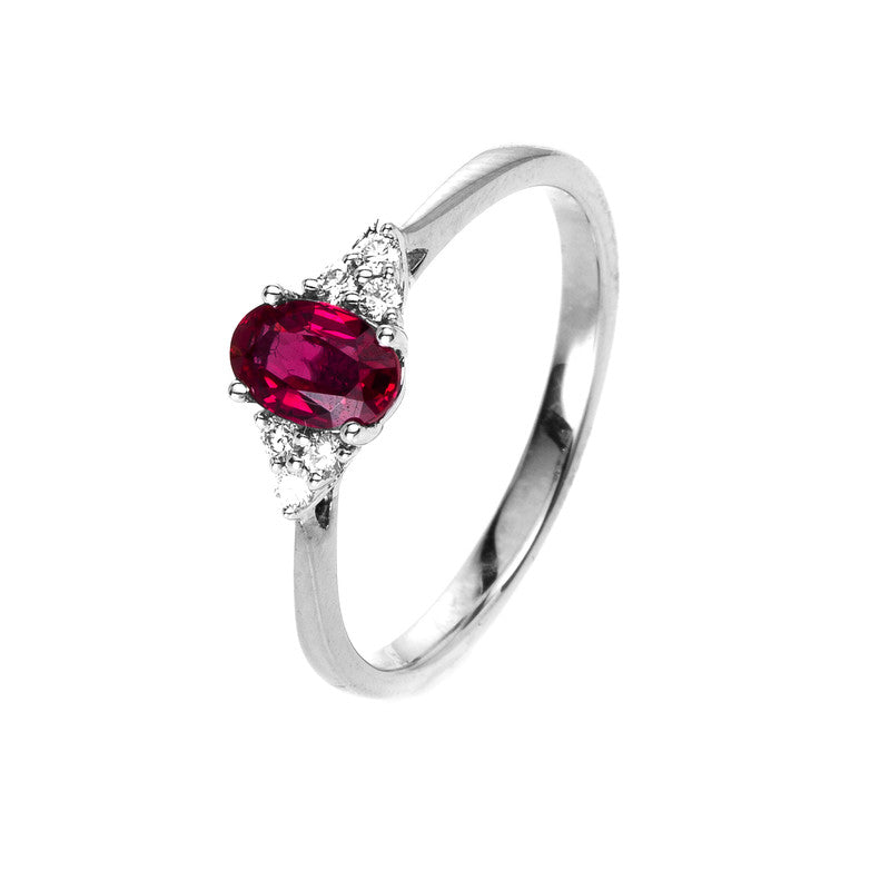 Ring 18 kt WG, 6 Brill. 0,09 ct, TW-si, 1 Rubin 0,49 ct rot