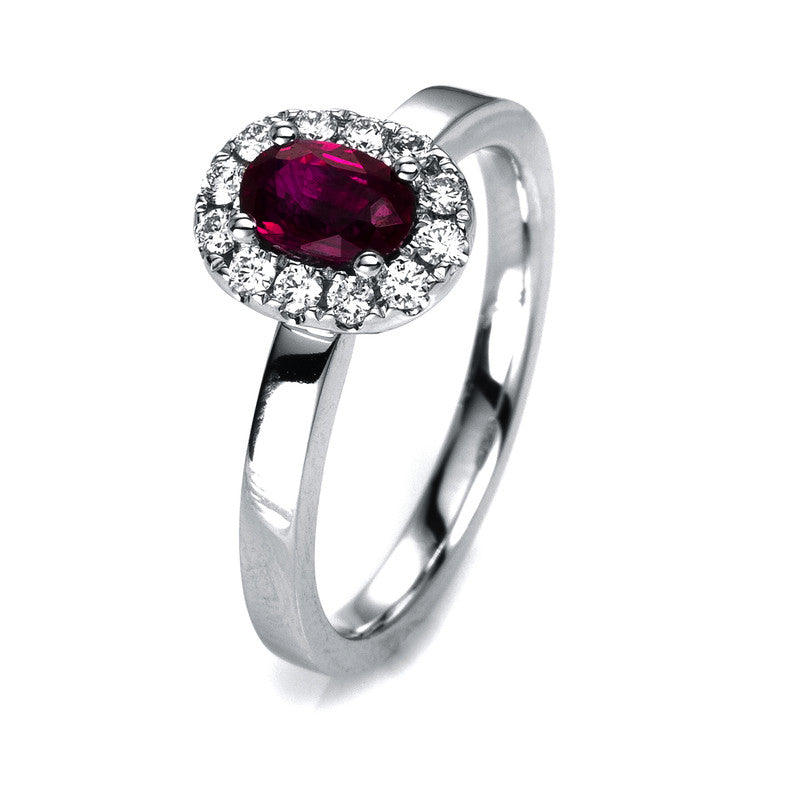 Ring 18 kt WG, 12 Brill. 0,22 ct, TW-vsi/si, 1 Rubin 0,58 ct rot