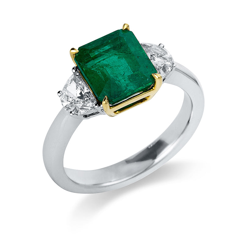 Ring 18 kt WG+GG, 2 Halbmond 0,73 ct, TW-si, 1 Smaragd 3,00 ct grün