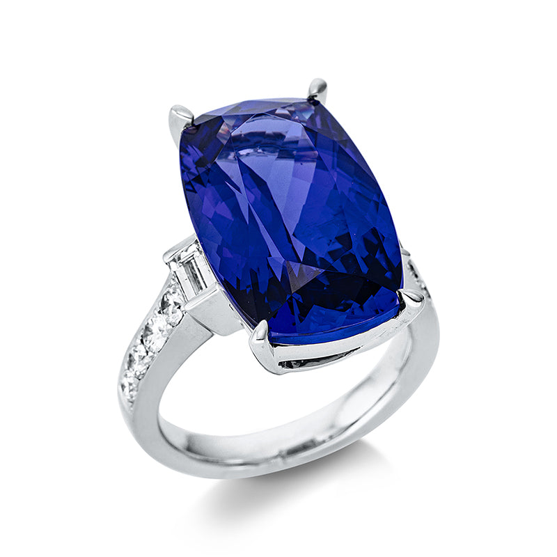 Ring 4er-Krappe 18 kt WG. 2 Baguette 0.33 ct. TW-si. 8 Brillanten 0.54 ct. TW-si. 1 Tansanit 17.12 ct blau. H:15.7 mm. B:20.6 mm. Weite:54.5