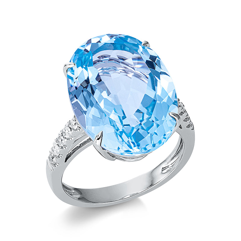 Ring 4er-Krappe 18 kt WG. 10 Brillanten 0.20 ct. TW-si. 1 Topas 16.50 ct sky blue. H:13.1 mm. B:18.1 mm. Weite:54