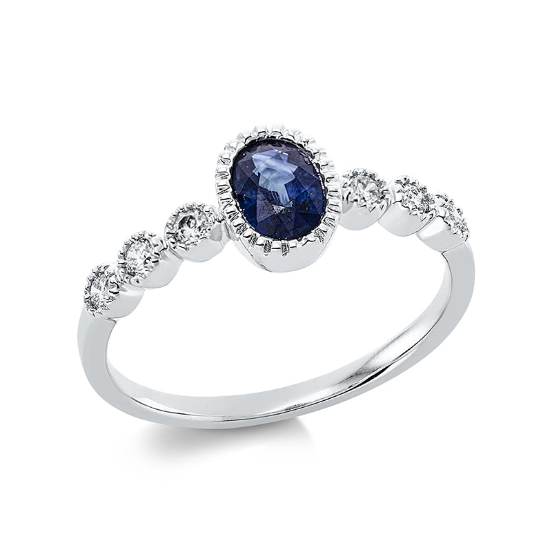 Ring 18 kt WG. 6 Brillanten 0.16 ct. TW-pi. 1 Saphir 0.57 ct blau. H:18.6 mm. B:7.3 mm. Weite:54