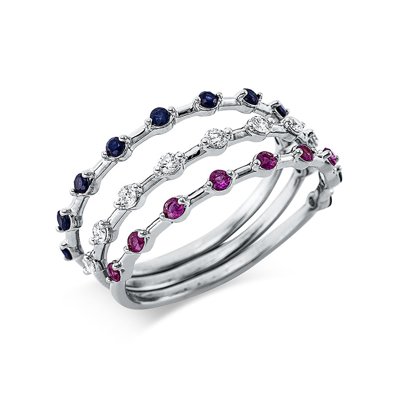Ring 18 kt WG. 9 Brillanten 0.14 ct. TW-si. 9 Rubine 0.16 ct rot. 9 Saphire 0.18 ct blau. B:5.0 mm. Weite:54