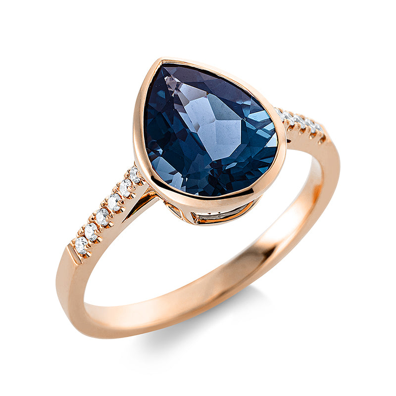Ring 18 kt RG. 12 Brillanten 0.08 ct. TW-si. 1 Topas 3.10 ct Lond. blue. H:8.8 mm. B:11.1 mm. Weite:54