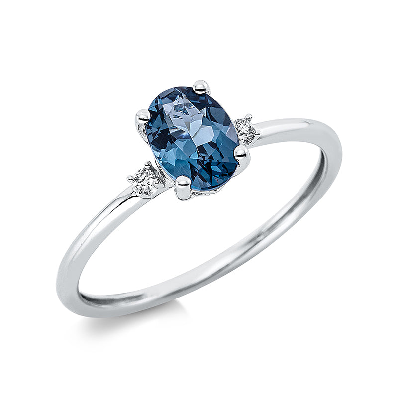 Ring 18 kt WG, 2 Brill. 0,03 ct, TW-si, 1 Topas 0,90 ct Lond. blue
