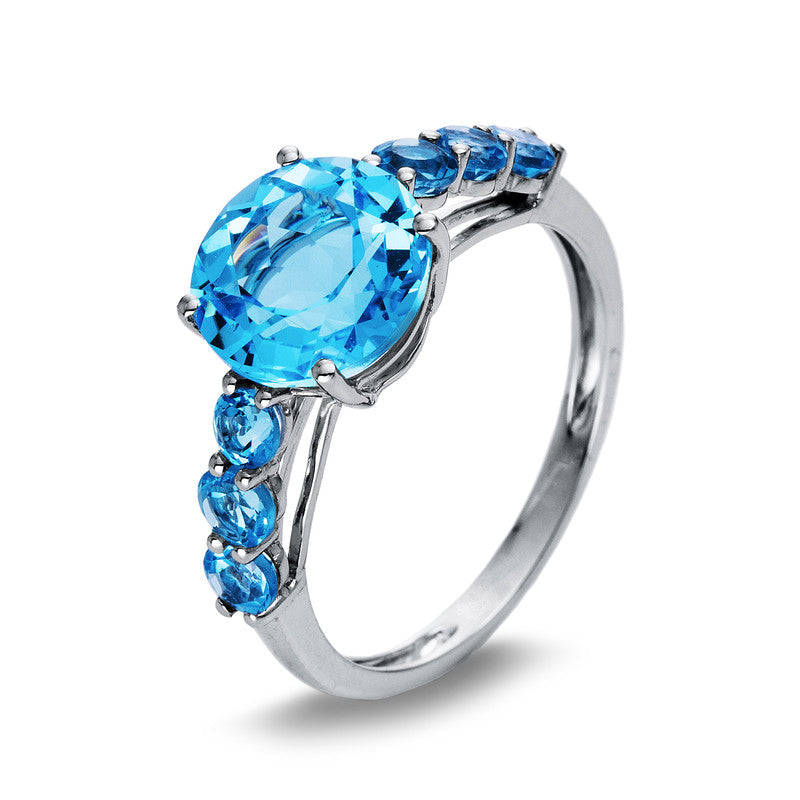 Ring 4er-Krappe 18 kt WG. 1 Blautopas 3.50 ct blau. 6 Blautopase 0.90 ct blau. Weite:54