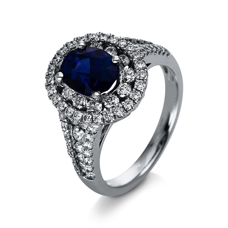 Ring 4er-Krappe 18 kt WG. 16 Brillanten 0.49 ct. TW-si. 64 Brillanten 0.65 ct. TW-si. 1 Saphir 2.51 ct blau. Weite:53
