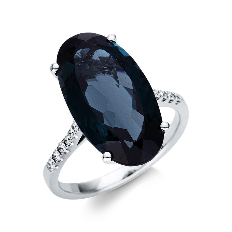 Ring 18 kt WG, 12 Brill. 0,12 ct, TW-si, 1 Topas 10,80 ct Lond. blue