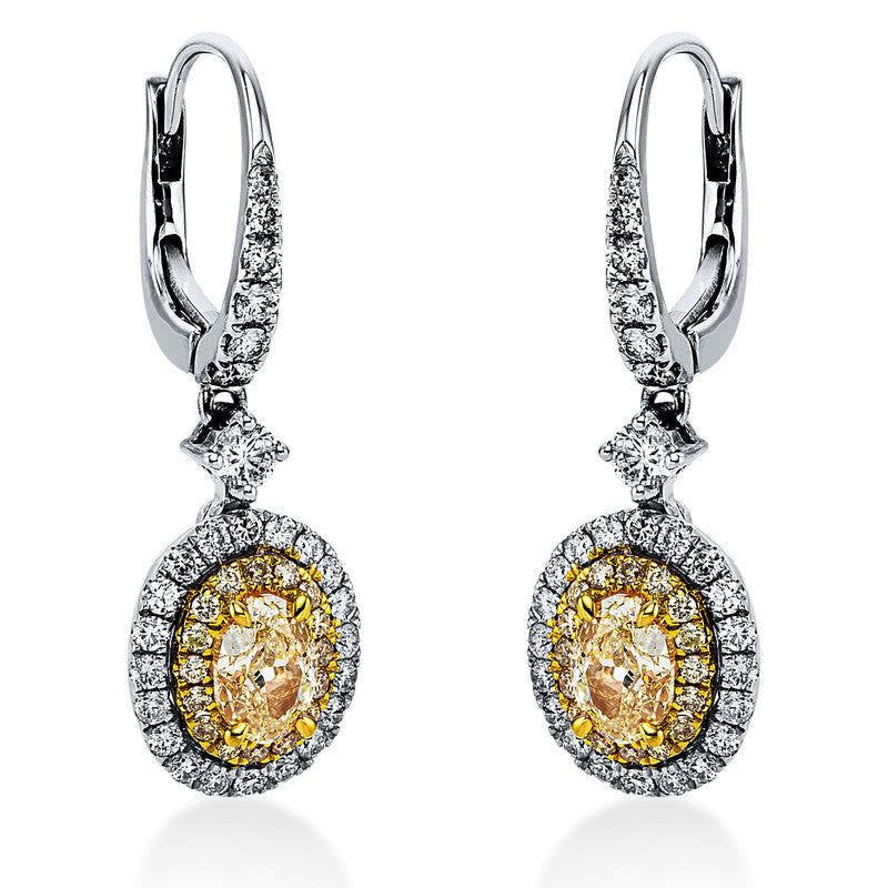Ohrschmuck 18 kt WG+GG, 54 Brill. 0,65 ct, TW-si, 2 Oval 1,04 ct, gelb, 32 Brill. 0,18 ct, gelb