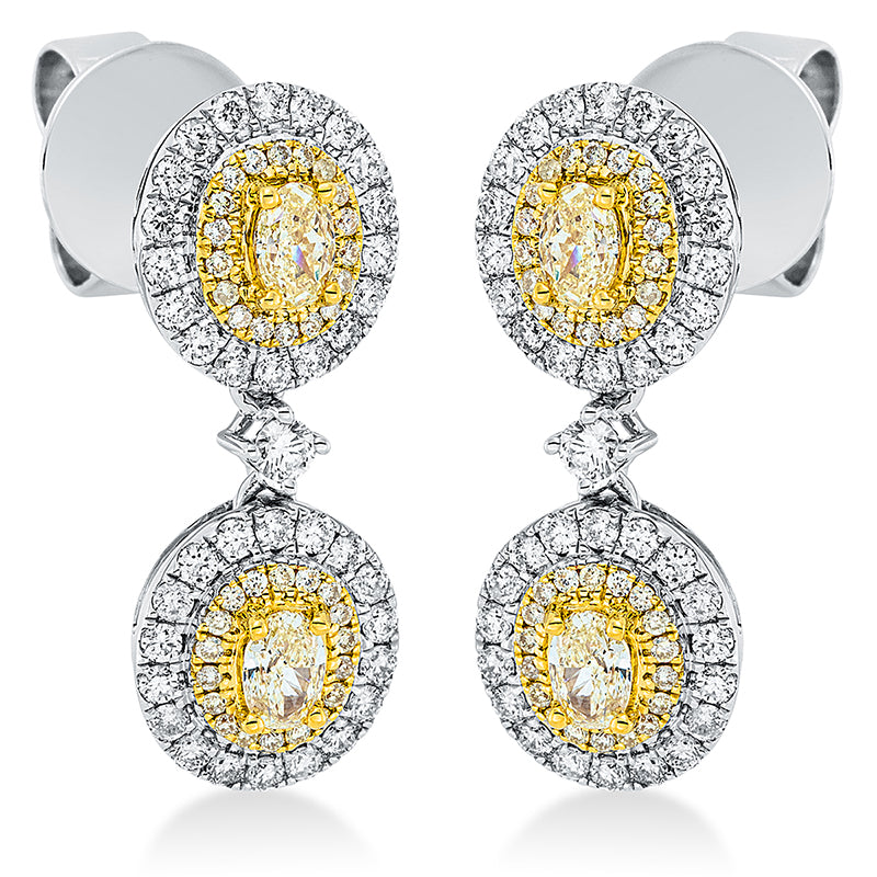 Ohrschmuck 4er-Krappe 18 kt WG+GG. 74 Brillanten 0.70 ct. TW-si. 4 Oval 0.63 ct. gelb. 72 Brillanten 0.19 ct. gelb. H:21.9 mm. B:8.4 mm. S:4.4 mm