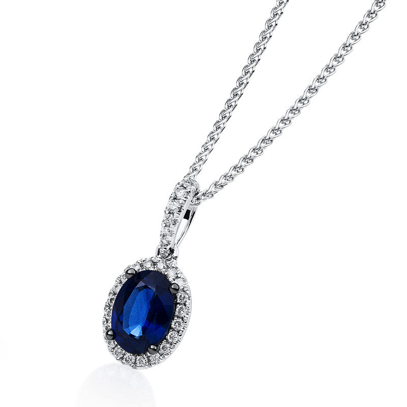 Anhänger 18 kt WG, Fassung teils schwarz rhodinie, 26 Brill. 0,12 ct, TW-si, 1 Saphir 1,02 ct blau