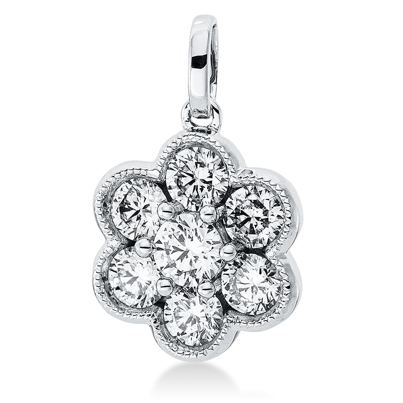 Anhänger 18 kt WG. mit Öse. 1 Brill. 0.15 ct. TW-si. 6 Brillanten 0.54 ct. TW-si. H:15.8 mm. B:10.7 mm. S:5.4 mm