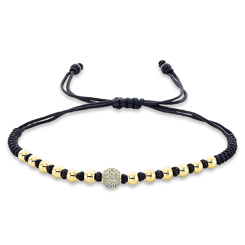 Armband 18 kt GG. black cord strap.gold ball. 31 Brillanten 0.16 ct. TW-si. 2 Onyx 0.84 ct schwarz. B:5.8 mm. L:31.0 cm. S:5.8 mm