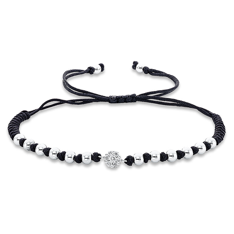 Armband 18 kt WG. black cord strap.gold ball. 1 Brill. 0.05 ct. TW-si. 6 Brillanten 0.13 ct. TW-si. B:5.5 mm. L:31.0 cm. S:2.0 mm