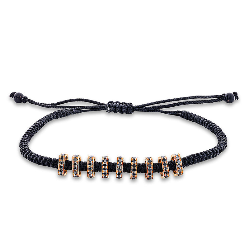 Armband 18 kt RG. black cord strap. 72 Brillanten 0.60 ct. schwarz. 2 Onyx 0.79 ct schwarz. L:31.0 cm