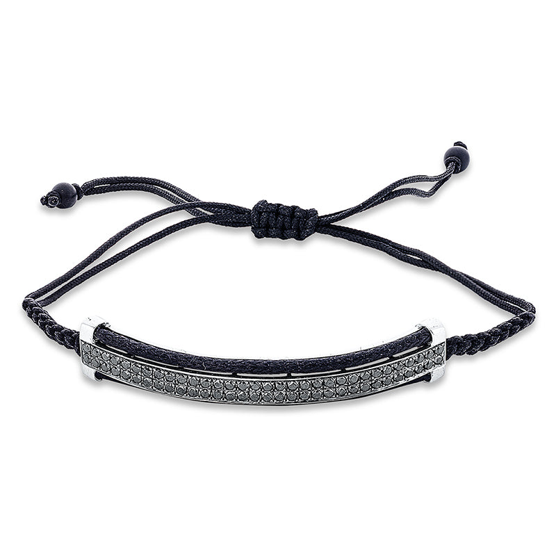 Armband 18 kt WG. Fassung teils schwarz rhodinie. 64 Brillanten 0.99 ct. schwarz. 2 Onyx 0.92 ct schwarz. L:31.0 cm