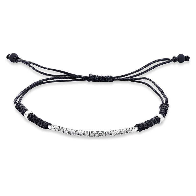Armband 18 kt WG. black cord strap. 15 Brillanten 0.22 ct. TW-si. 2 Onyx 0.90 ct schwarz. B:1.6 mm. L:31.0 cm. S:2.2 mm