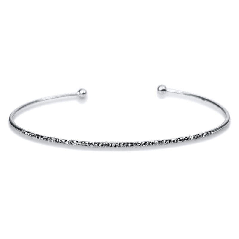 Armreif 18 kt WG. 53 Brillanten 0.15 ct. TW-si. H:45.0 mm. B:55.0 mm. S:1.3 mm